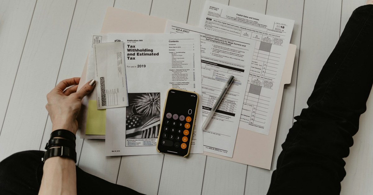 Homeowner reviewing monthly housing costs while deciding between renting and buying